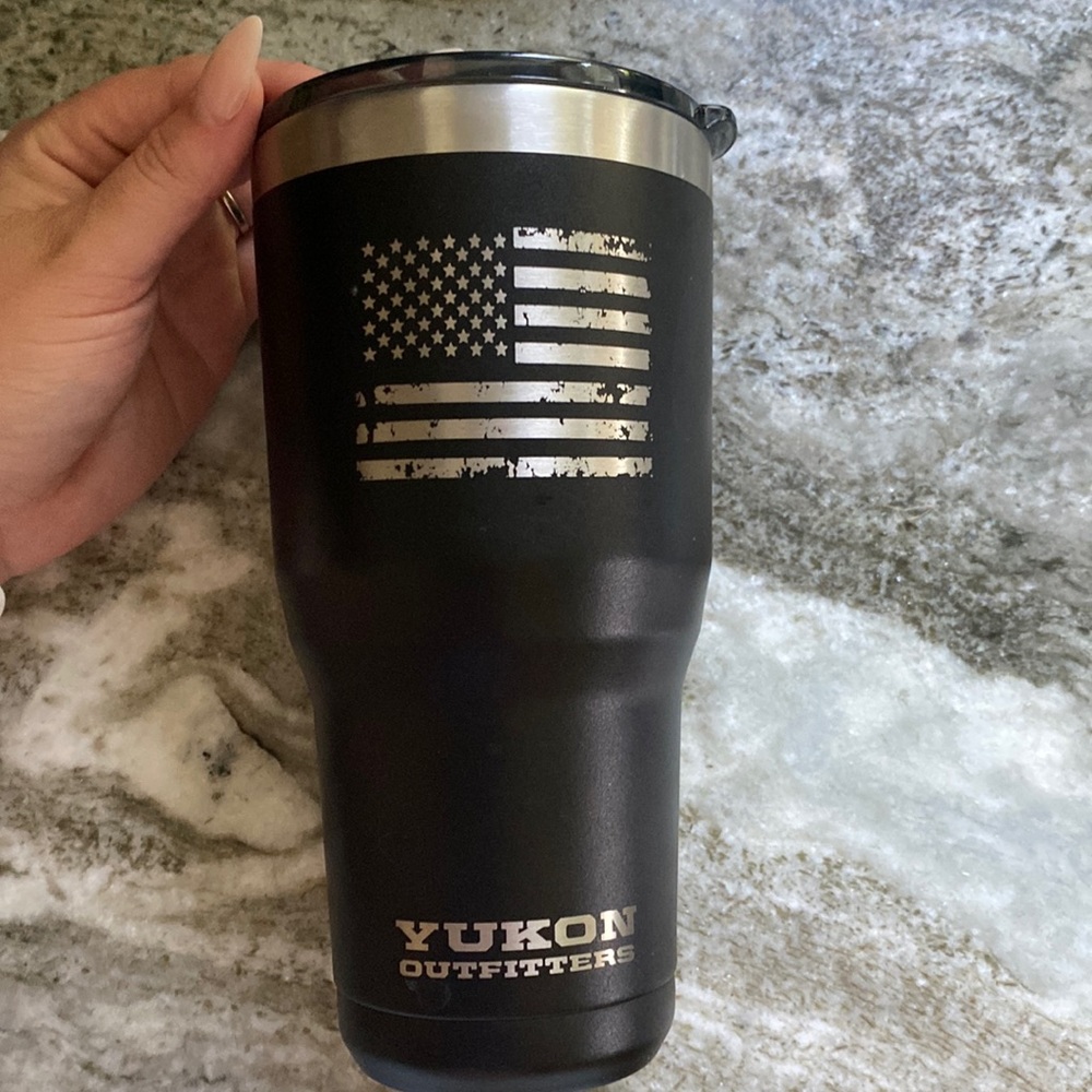 Black Yukon Outfitters tumbler.